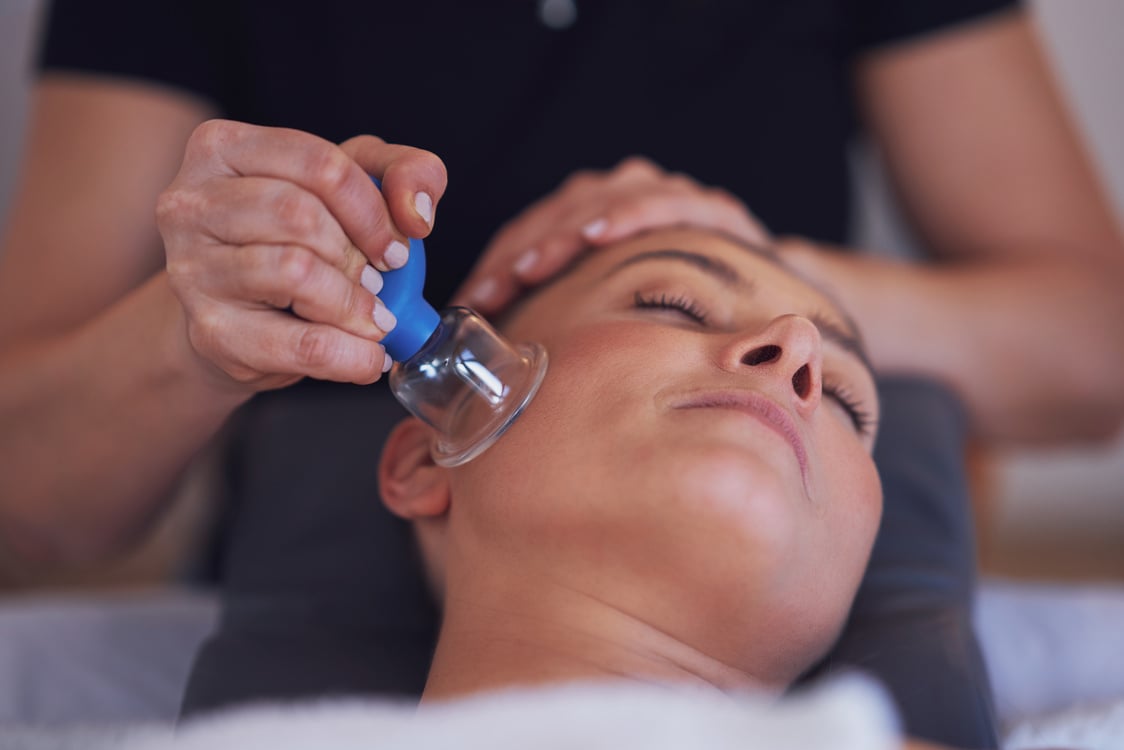 Woman Having a Face Cupping Massage in Salon